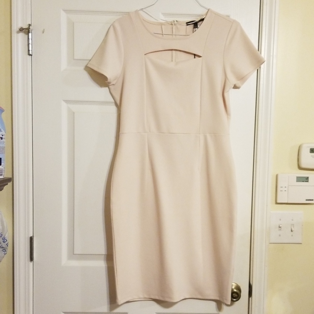 Ladies plus size cream color dress.